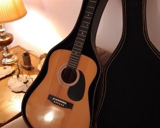 Student guitar, basement. Turn left when you enter the sale house, then head down the stairs to the finished basement.