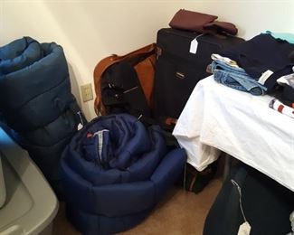 Last bedroom on the left also has luggage and sleeping bags and overflow clothing.