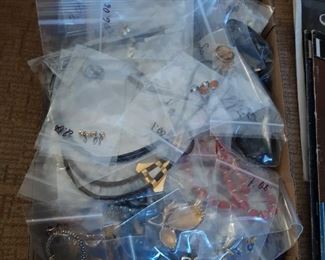 Costume jewelry, on the sofa, front living room/checkout room.