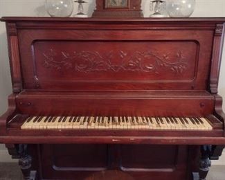 Piano and claw and black stool