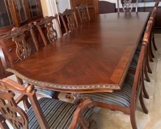 Dining Table shown with  2 leaves  Seats 10               Comes with table protection pads
