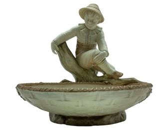 ANTIQUE BOY SITTING ON BRANCH WITH WOVEN BASKET IVORY COLORED COMPOTE BOWL | COLLECTIBLE PORCELAIN FIGURINES
-C. 1880'S
-IMPRESSED MARK 775 STAMPED Z
-7" X 6" X 6" APPROX
-VERY GOOD CONDITION
-DP22322