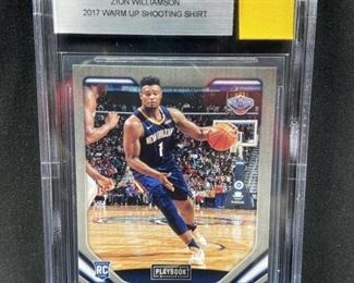  2017 Zion Williamson Rookie w/ Warm Up Shirt.  Yellow square at top right is an official warm-up used shirt patch.