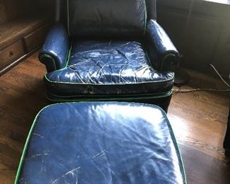 Well worn blue leather chair with ottoman