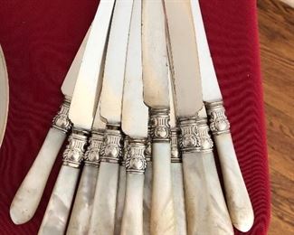 Set of 12 MOP dinner knives with sterling bands