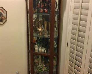 Corner display cabinet. 6‘4“ tall. 24 inches wide. 18 inches deep. Contents sold separately.