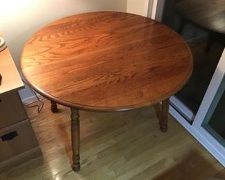 42 inch diameter round with leaves out.