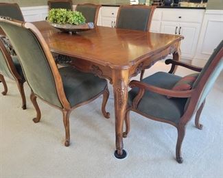 Dining Table with 8 Chairs, 2 leaves and pads by Drexel Heritage.