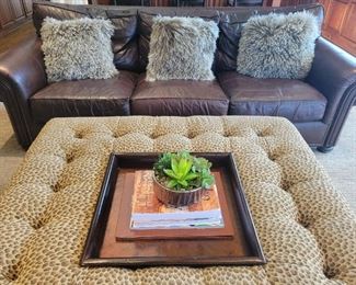 Leather Sofa and Leopard Print Coffee Table both by Tommy Bahama.