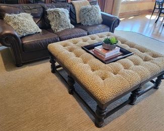 Leather Sofa and Leopard Print Coffee Table both by Tommy Bahama.