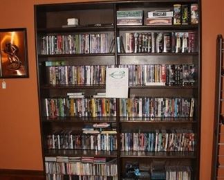 Shelves full of DVD, HD and blue ray movies and CD'S and some VHS