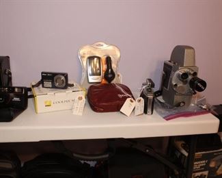 Vintage Cameras: Revere 103, Agfa Solinette, Nikon Coolpix S550, Nikon Smile Taker, Argus 806, Gossen LunaPro F Light Meter, Canon Sure Shot Z115, Polaroid Impulse AF