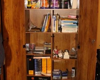 wood storage closet with CD, DVD and other camera items
