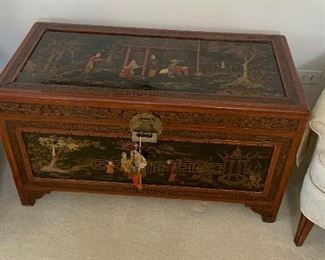 Chinese Lift Top chest, carved and decorated lacquer decoration on top and sides of scholars in a garden.  Camphorwood and cedar.  Measures 40x21x20