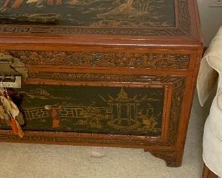 Chinese Lift Top chest, carved and decorated lacquer decoration on top and sides of scholars in a garden.  Camphorwood and cedar.  Measures 40x21x20