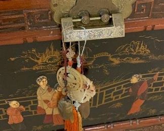 Chinese Lift Top chest, carved and decorated lacquer decoration on top and sides of scholars in a garden.  Camphorwood and cedar.  Measures 40x21x20