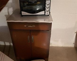 Metal kitchen cabinet with formica top