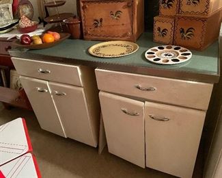Metal kitchen cabinets.  Vintage green countertop.