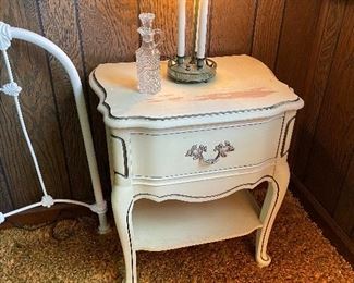 One of two bedside tables