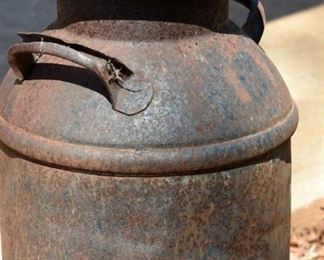 rusted iron milk can