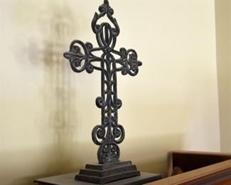metal cross on wooden base
