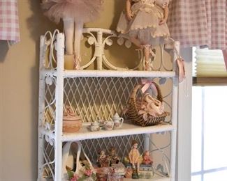 white wicker display shelf, dolls and figurines 