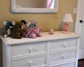 white wicker chest of drawers and mirror