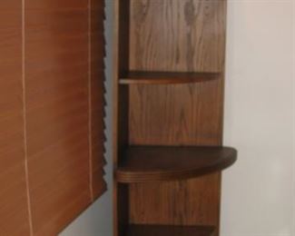 Corner shelf with light on top shelf