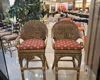 Wicker swivel barstools.