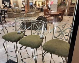 3 bar stools that swivel.