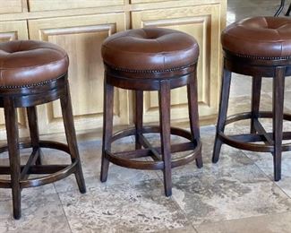 Theodore Alexander Leather Swivel Stools	25x16in diameter	
