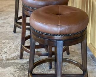 Theodore Alexander Leather Swivel Stools	25x16in diameter	

