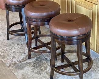 Theodore Alexander Leather Swivel Stools	25x16in diameter	
