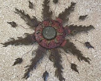 Metal and glass sun wall decor	44in in diameter	
