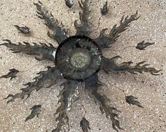 Metal and glass sun wall decor	44in in diameter	
