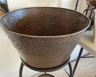 Metal planter/ice bucket with stand decor	34 in tall 18 in diameter	
