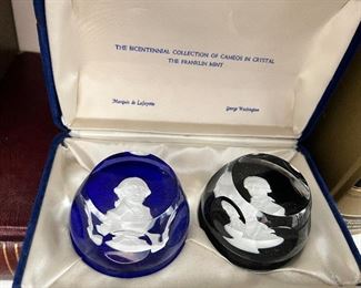 The Bicentennial Collection of Cameos in Crystal by the Franklin Mint. Cameo of blue - Marquis de Lafayette. Cameo of black- George Washington