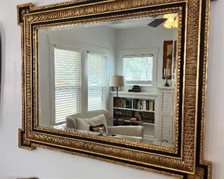 Large black and gold mirror
