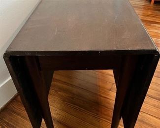 Side view of antique drop leaf table