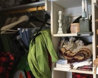 Closet is packed with fabrics, pillows, sewing a& craft items and more - master bedroom