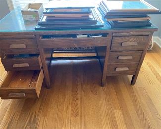 Large vintage wooden desk with glass top