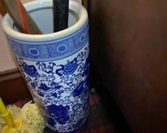 Ceramic umbrella stand with umbrellas