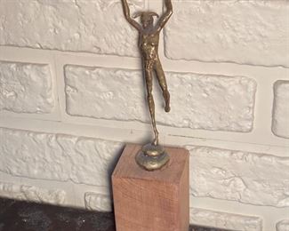 Small Satyr figure of brass on wood pedestal