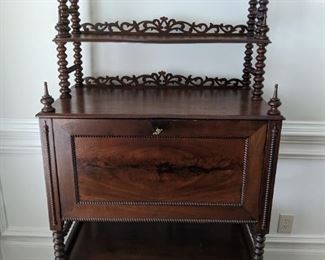Vintage and very unique drop-front mahogany writing desk/curio cabinet, with spindle finials.