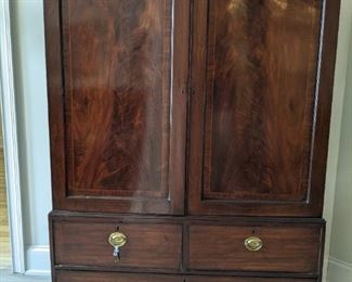 Gorgeous 20th century English mahogany linen press!