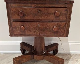 Victorian era burled mahogany 2-drawer chest, w/wooden pulls; metal casters.