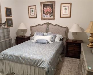 Queen size upholstered headboard, with silver leaf finish, new mattress and boxspring. This is in the guest bedroom, which was rarely ever used. 6-drawer silver leafed dresser, coordinating wall mirror, pair of mahogany 3-drawer nightstands and very nicely framed original artwork.