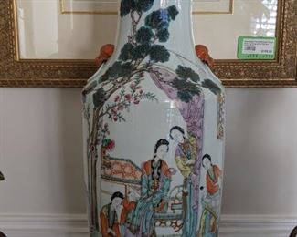 Close-up of the hand-painted Asian "Happy Family" porcelain vase.