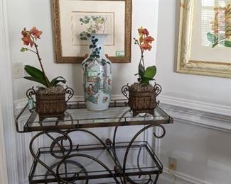 This is the bronze finish brass tea cart, from Barcelona, with antique French cachepots, w/metal liners, fresh orchid plants and large, hand-painted Asian "Happy Family" porcelain Vase, 23" tall.