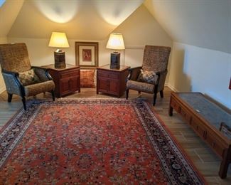 Pair of woven rattan armchairs, pair of hand-carved wooden glass-topped Asian chests, matching Asian hand-carved glass-topped coffee table, pair of Vintage Frederick Cooper Asian Tea Tin lamps and hand-woven Persian Tabriz design rug, measures 7' 8" x 9' 8".